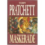 Terry Pratchett signed hard back book Maskerade. Signed on title page. Good condition. Dust Cover.