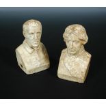 A pair of mid 19th century waxed plaster busts of Nelson and Wellington, the reverse signed