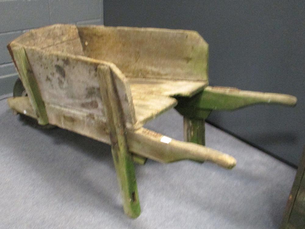 A WWII Aircraft wheel, fitted to a wood garden wheelbarrow