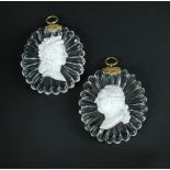 A pair of 1820s Baccarat sulphide plaques of Louis XVI and Marie Antoinette, the clear glass ovals