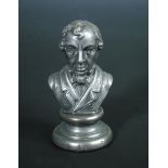 A mid 19th century pewter pepper modelled as a bust of Disraeli, 8.5cm (3.75in) high