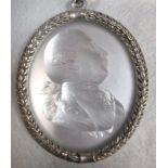 A 1761 satin glass relief profile of George III in later silver mounts with neck chain, the King