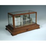 A barograph by Ross, New Bond Street, London, in a mahogany case with a single drawer 21 x 37 x 22cm