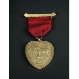 Society for the Encouragement of Kindness to Animals - a silver gilt medallion of heart shape, 1.8oz
