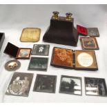 A miscellaneous collection of 19th/20th century photographic equipment and photographs on glass,