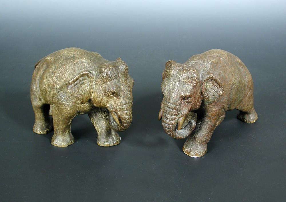 A pair of Japanese early 20th century bronze Indian elephants, one with crescent moon motif to its