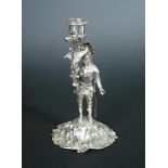 A silver candlestick in the form of a standing knight in full armour, London 1845, 19cm (7in)