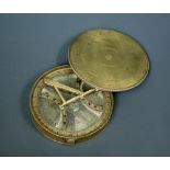 A George III brass pocket compass, the circular lidded body with interior glass, silvered dial and