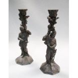 A pair of Gothic revival caste iron candlesticks in the form of Knights, 25cm (10in) high