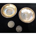 A pair of Maltese silver coin dishes inset with a 1 Scudo/ 12 Tari coin, with bust of Emmanuel de