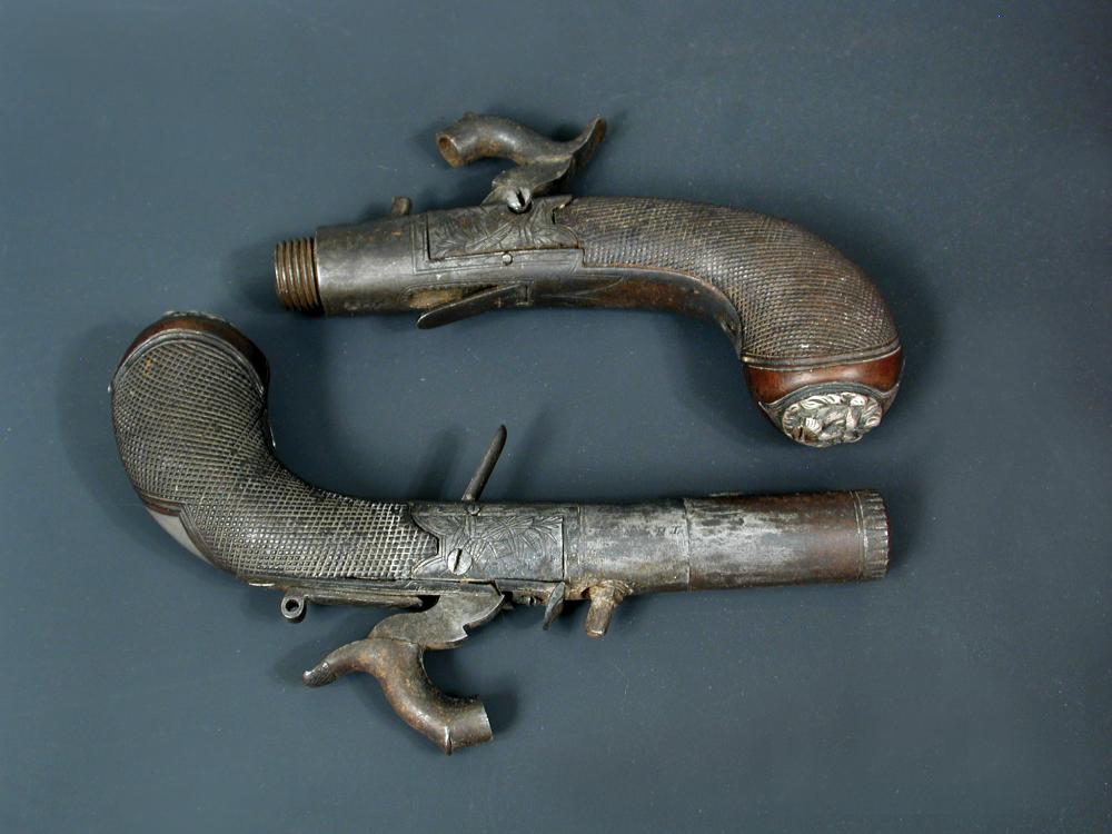 A pair of early 19th century pocket percussion pistols, with turn off barrels (one lacking barrel