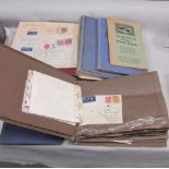 A box containing SG Simplex stamp album and several small albums and envelopes containing covers.