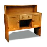A Heal's oak dresser, the shelf back over a rectangular top above a central drawer and open shelf