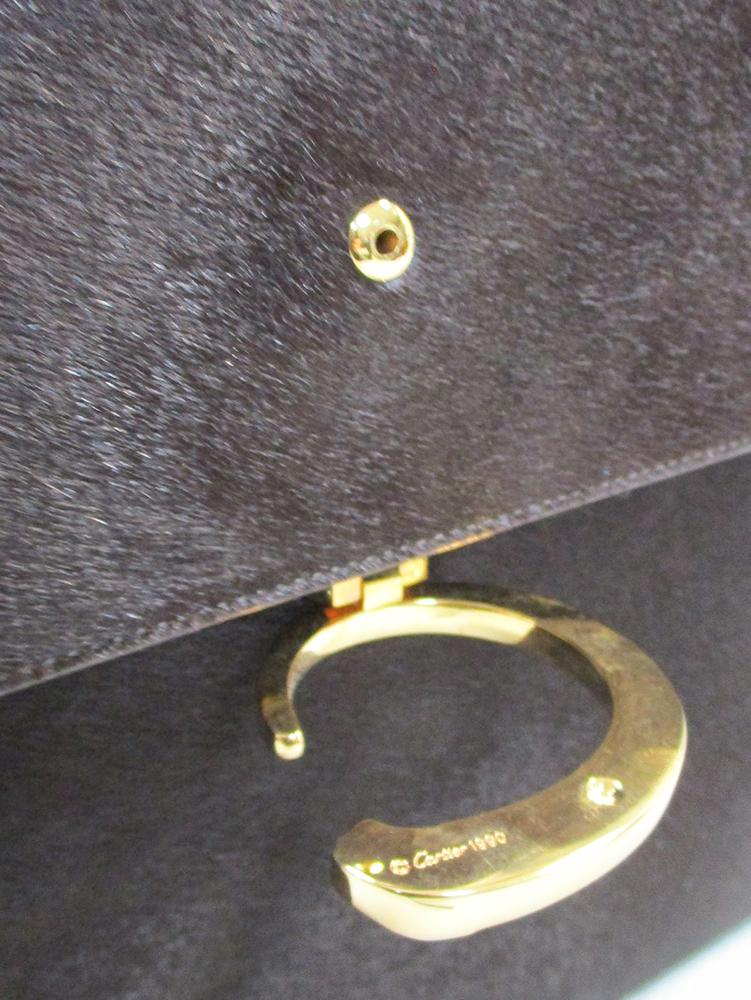 Cartier, a brown ponyskin handbag, with gilt 'panthere' clasp and original dust bag 22 x 28cm (9 x - Image 3 of 5
