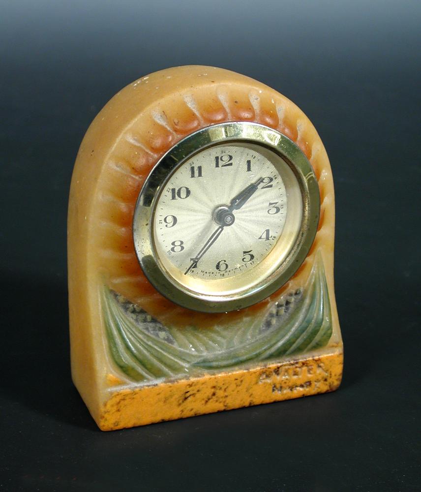 Almeric Walter, a pate-de-verre glass clock case, moulded as a flower head with foliage, signed in