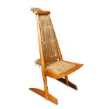 An unusual late 20th century rush-seated olive wood chair, supported on sleigh feet 130 x 53 x