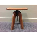 A mid 20th century hardwood machinist adjustable stool, with dished seat 60cm (23in)
