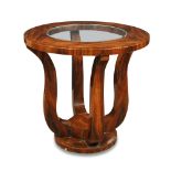 An Art Deco walnut occasional table, the circular top with inset glass centre raised on four