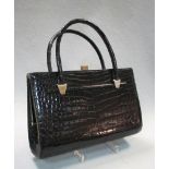 Christian Dior, a vintage black patent 'crocodile' leather handbag, with gilt snap closure,