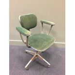 A 1950's Evertaut industrial swivel armchair, with padded arms and seat 86 x 64cm (34 x 25in)