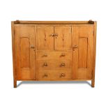 A Heal's oak sideboard or compactum, circa 1910, the galleried top above a pair of central