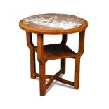 An Art Deco marble topped walnut occasional table, the circular top on shaped legs united by a