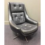 Henry Walter Klein (born 1919), a black leather swivel lounge chair, on a chromed support 85 x