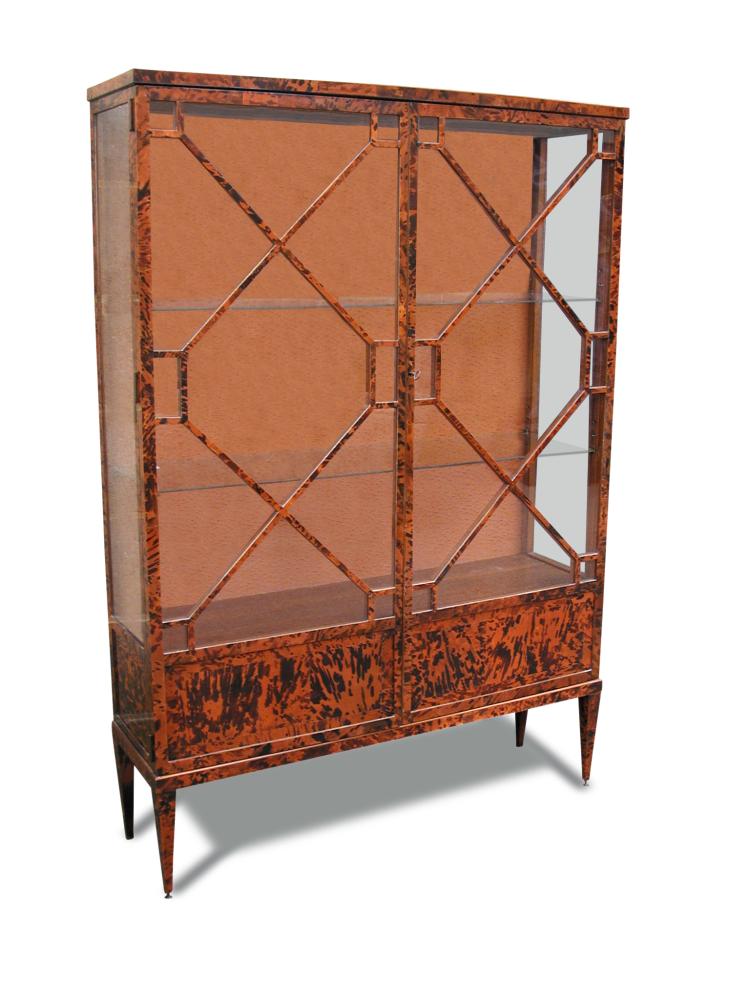 A Tortoiseshell veneered display cabinet, early 20th century with astragal glazed doors, on tapering