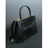 Celine, a black patent leather faux snakeskin handbag, stamped to inside, with detachable shoulder