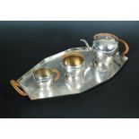 An early 20th century German metalwares four-piece tea service, by Friedlander, comprising teapot