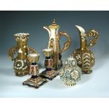A collection of Zsolnay and Fischer reticulated wares, comprising various ewers and vases along with