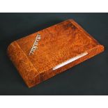 An Italian Art Deco burr walnut cigarette box, the rounded rectangular box with hinged cover,