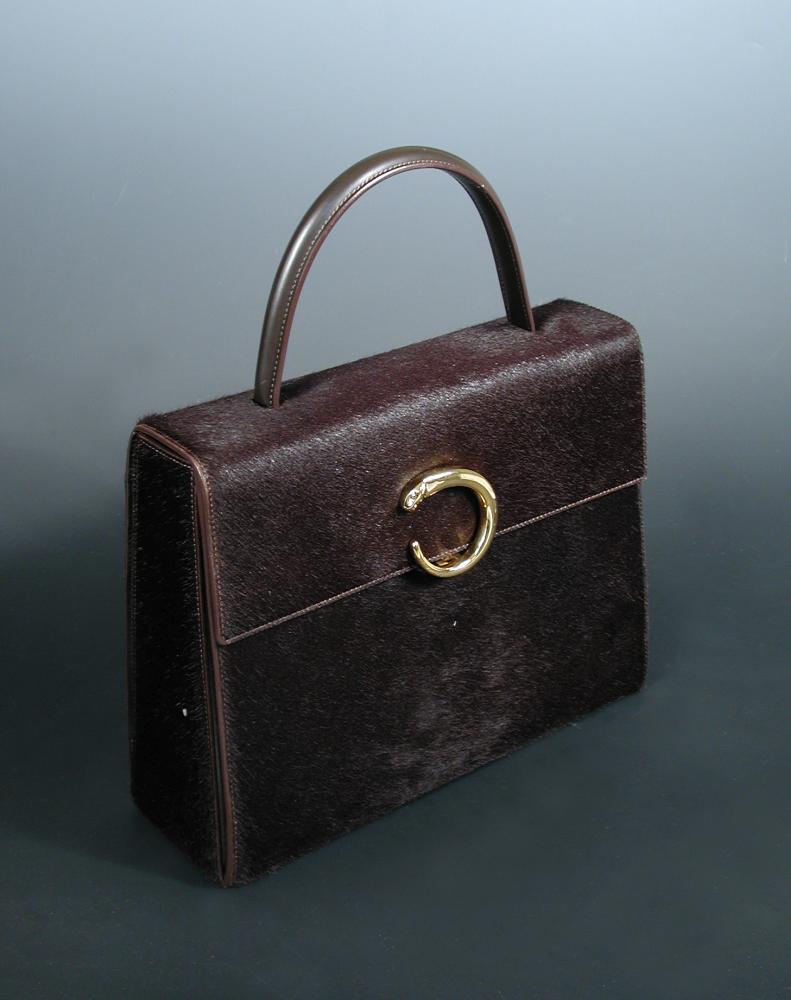 Cartier, a brown ponyskin handbag, with gilt 'panthere' clasp and original dust bag 22 x 28cm (9 x