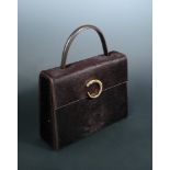Cartier, a brown ponyskin handbag, with gilt 'panthere' clasp and original dust bag 22 x 28cm (9 x