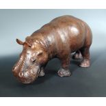 A 20th century leather clad model of a hippo, naturalistically modelled and finished in brown