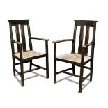 Liberty & Co., a set of six ebonised dining chairs, comprising two carvers and four singles each