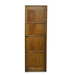 Peter Waals, a Cotswold School oak single wardrobe, originally part of a compactum, with panelled