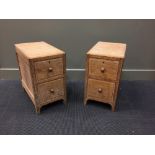A pair of Heal's limed oak bedsides, each with a pair of drawers, ivorine discs to drawer tops (2)