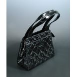 Chanel, a quilted black patent leather handbag, stamped to interior, with authentication card no