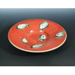 Catherine Ball, (British, 20th century), a studio pottery charger, the dished circular form with wax
