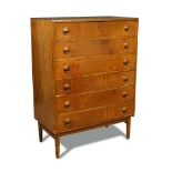 Kai Kristiansen, a Danish walnut veneered chest of drawers, the six drawers supported on tapering
