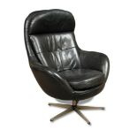 A mid-20th century black leather egg-type swivel armchair, on chromed support 102 x 79cm (40 x 31in)