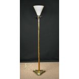 An Art Deco brass standard lamp/uplighter, the painted metal shade raised on a hexagonal column