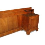 Gordon Russell, an oak two-piece bed head, circa 1930, comprising a pair od bedsides with cupboard