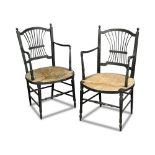 A pair of Morris & Co. Rossetti chairs, the ebonised frames with rush seats (2) 88cm (34in)