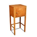 Attributed to Heal and Son, a quarter-sawn blonde oak bedside cupboard, circa 1930, the square top