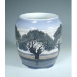 A large Royal Copenhagen vase, painted with a tree lined river landscape, painted and printed