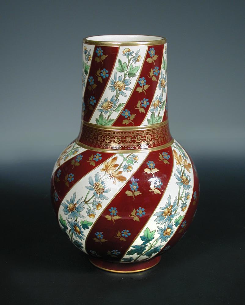 A large Sarreguemines floral painted vase, circa 1880 the baluster form painted and gilded with