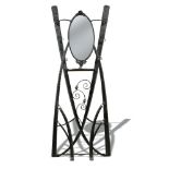 Attributed to Goberg, a wrought iron hall stand, the hammered strap work frame with oval mirror