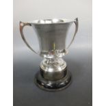 A 1912 Sheffield silver two handled trophy cup with wood stand